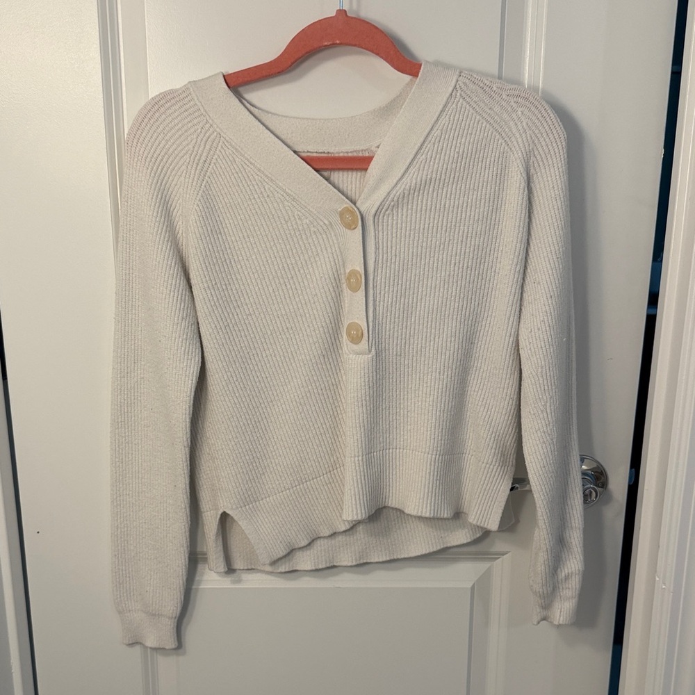 Elegant V-Neck Cream Sweater with Button Accents